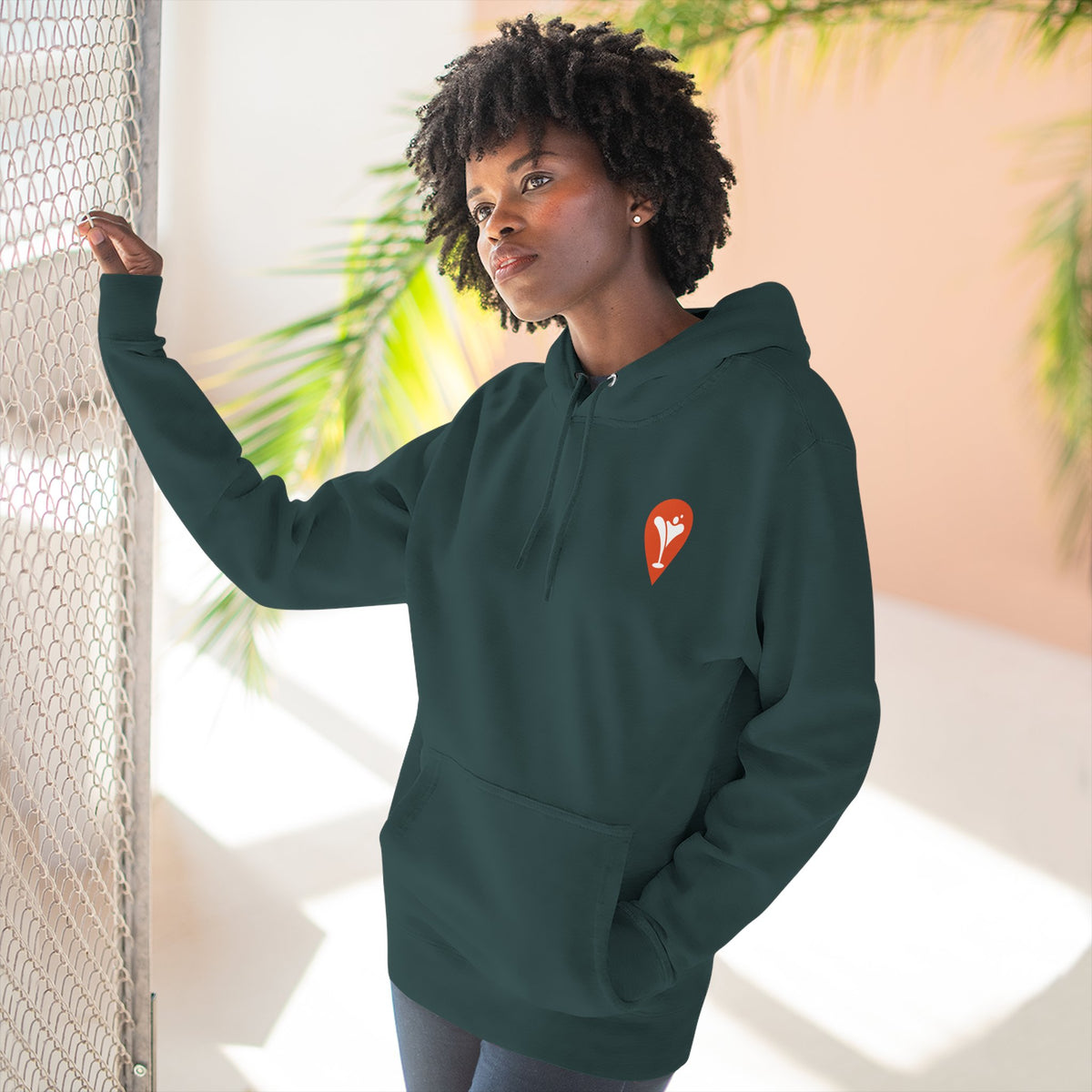 Gravity Skiing Fleece Hoodie in Sports Green, female model, front